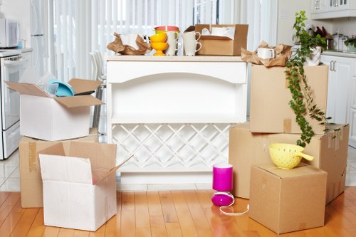 Packing boxes and home items ready for flat removals in Havering