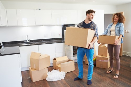 Boxes and unpacked essentials in a Havering property after relocation