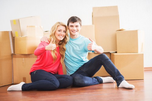 Same day removals crew transporting boxes and household items in Havering
